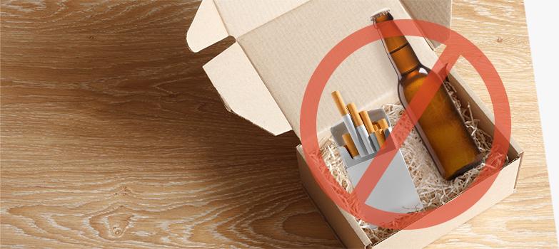 Alcohol and tobacco products in a packing box and crossed out to indicate that they cannot be shipped.